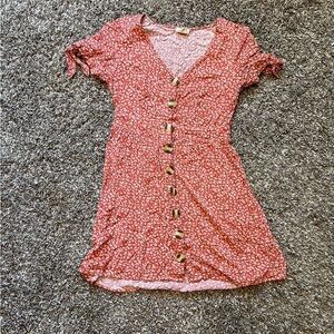 Red and white floral dress with tie up sleeves and button up front